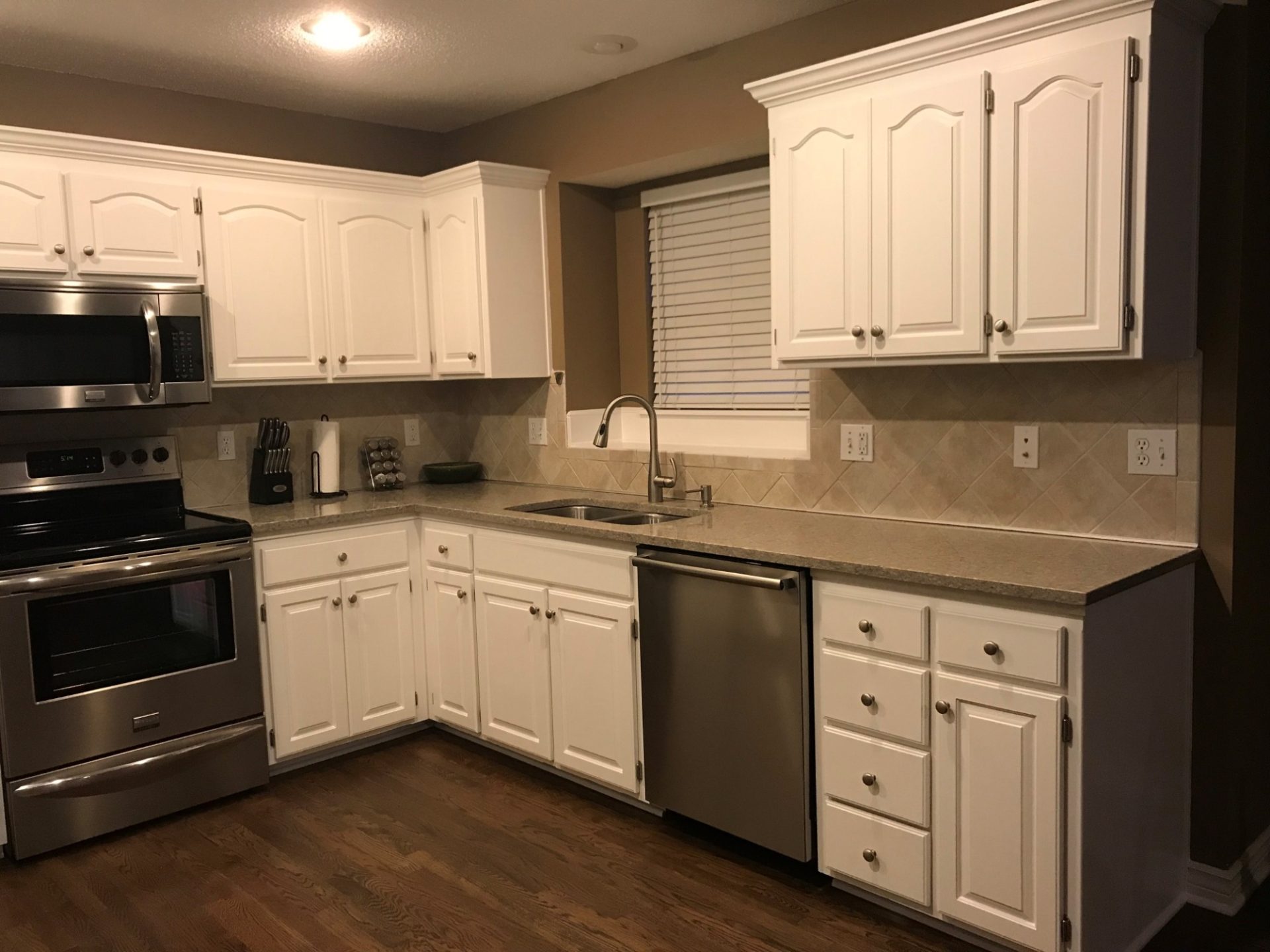 image of a kitchen with white cabinets