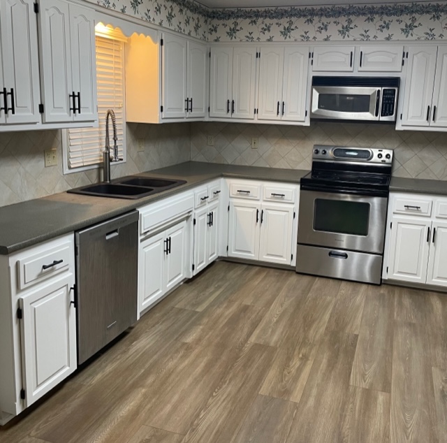 image of a kitchen with white cabinets