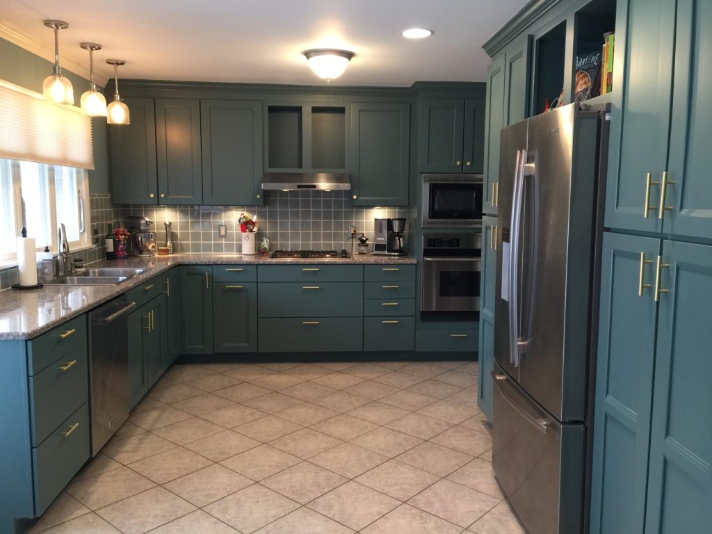 image of a kitchen with green cabinets