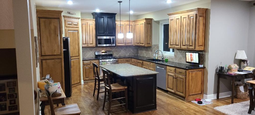 image of a kitchen with brown cabinets