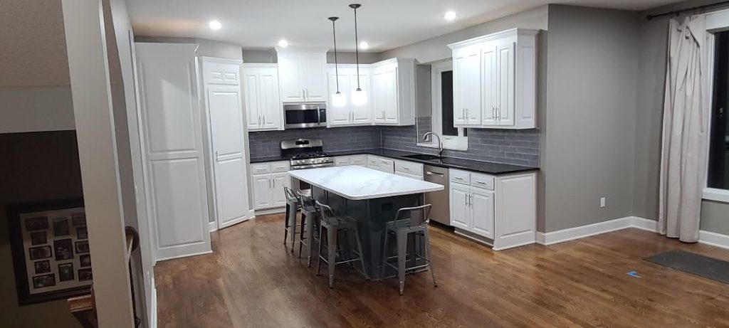 image of a kitchen with white cabinets