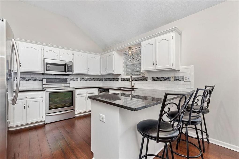 image of a kitchen with white cabinets