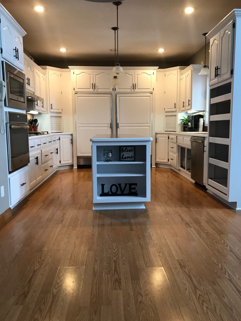 image of a kitchen with white cabinets