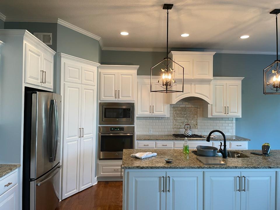 image of a kitchen with white cabinets