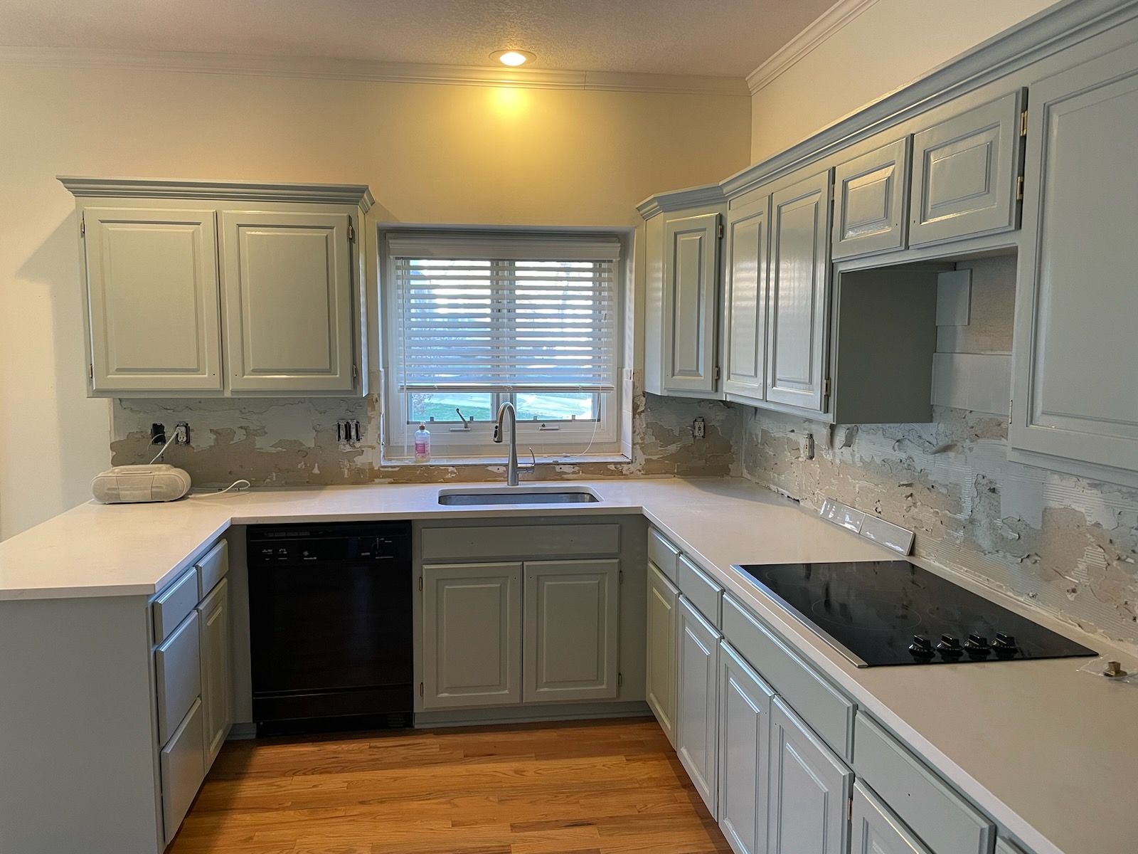 image of a kitchen with light grey cabinets