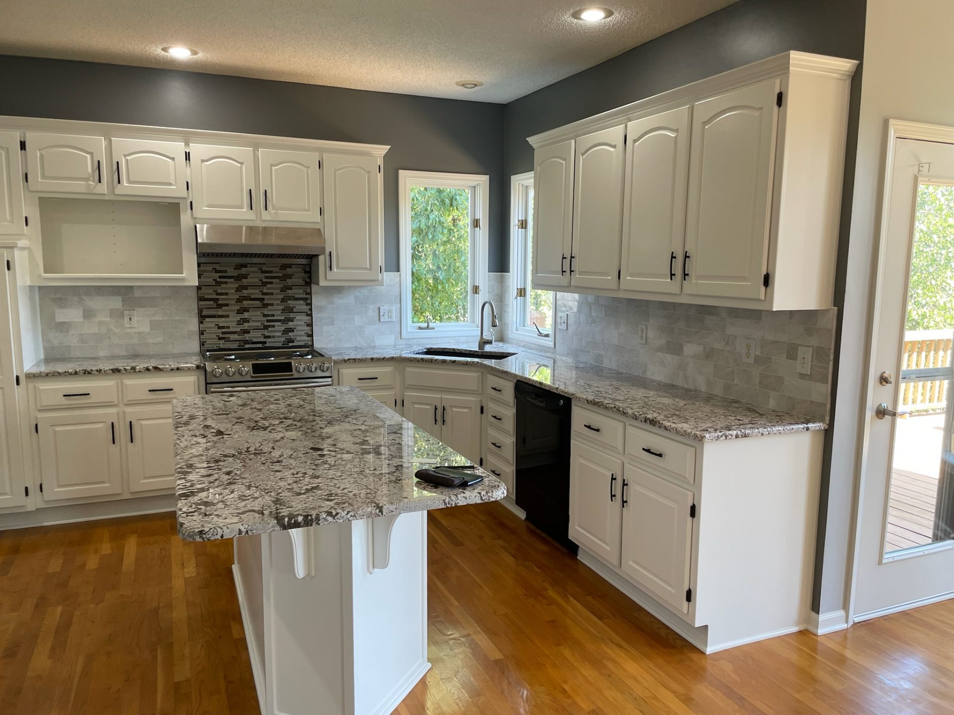 image of a kitchen with white cabinets