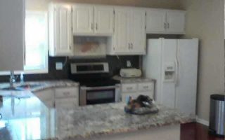 image of a kitchen with white cabinets