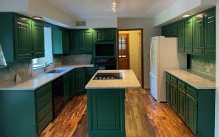 image of a kitchen with bold green cabinets