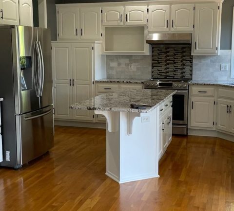 image of a kitchen with white cabinets