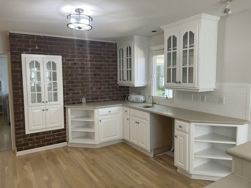 joe fletcher painting brick wall kitchen white paint cabinets gray countertops painted kitchen